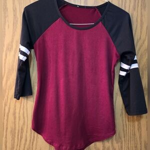 Very pretty, soft, long sleeve, maroon and black jersey type top. Size small.